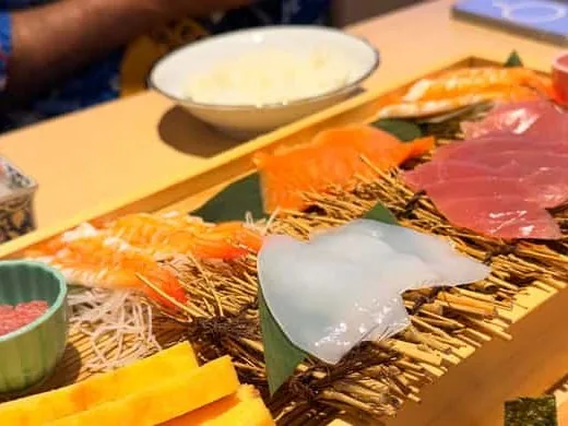 The spread of fish and rice at a hands-on sushi class